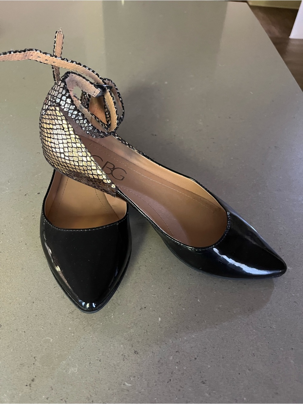BCBG Black Patent Pointed Toe Flats with Metallic Snakeskin Ankle Strap